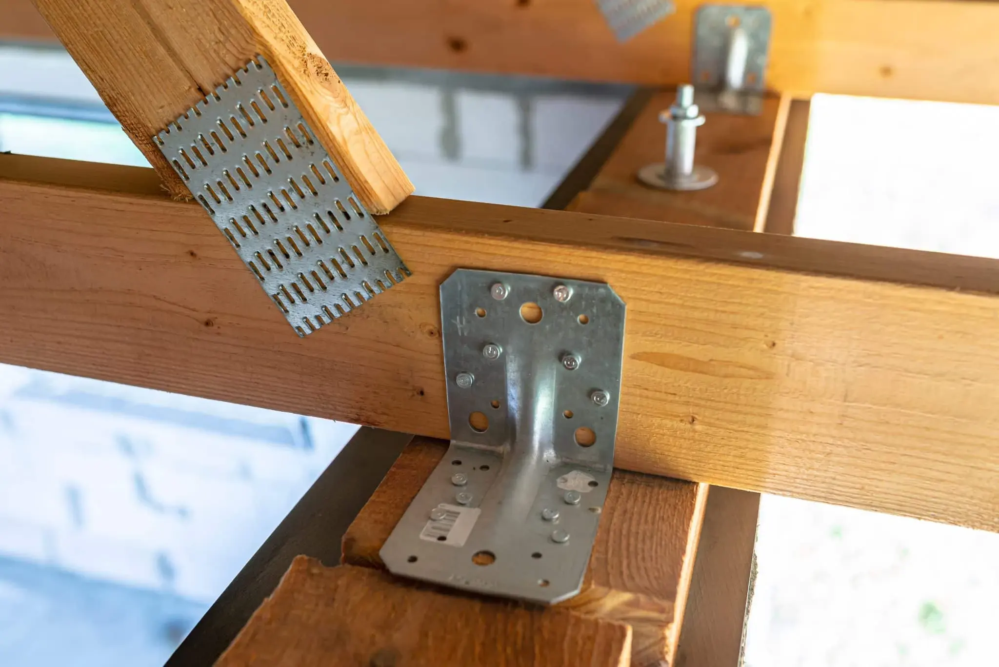 Galvanized structural connectors installed on wood framing
